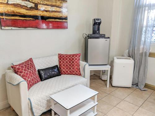 a living room with a couch and a coffee table at Casa Bonita Apartments in Long Beach