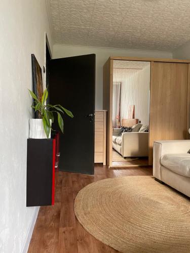 a bedroom with a bed and a potted plant at Nice apartment in Maardu in Maardu