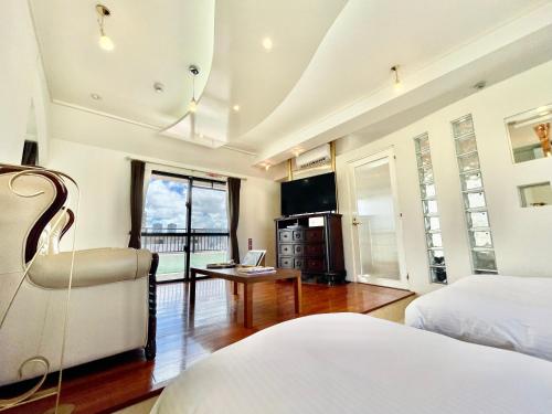 Televisyen dan/atau pusat hiburan di ホテル天使館 久茂地 -Tenshi-Kan-