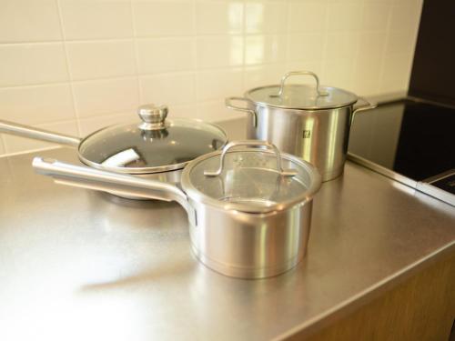 two pots and pans sitting on a kitchen counter at Coboushi ハナレ in Niseko