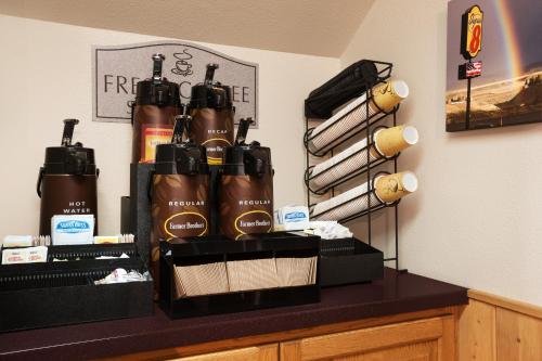 a group of bottles of hair products sitting on a counter at Super 8 by Wyndham Cody in Cody