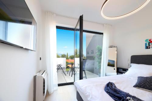 Posteľ alebo postele v izbe v ubytovaní Blue Dot Apartment