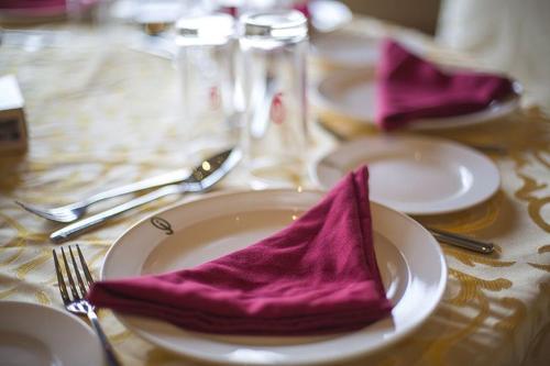 a white plate with purple napkin on a table at Diwan Alaseel Alraqi in Jeddah