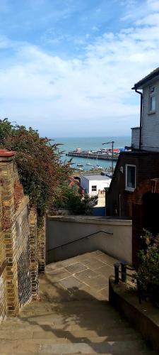 a view of the ocean from a balcony of a house at Beautifully appointed, period seaside apartment in Folkestone