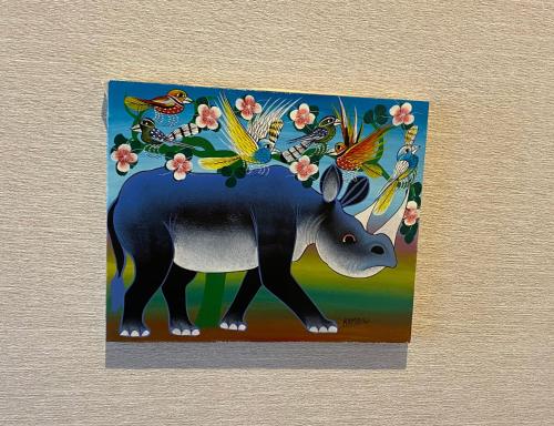 a painting of a rhino with flowers and birds at Kowakuen Haruka in Matsuyama