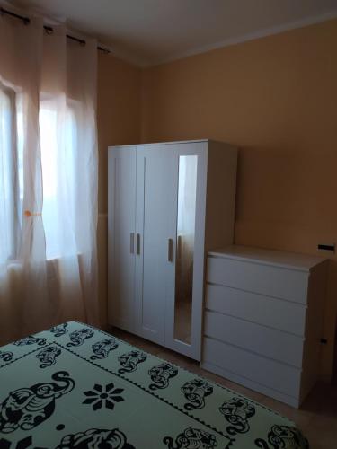 Katil atau katil-katil dalam bilik di Villetta Praia a Mare