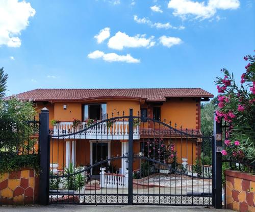 a house with a gate in front of it at Villa Di Gioia in Caccuri