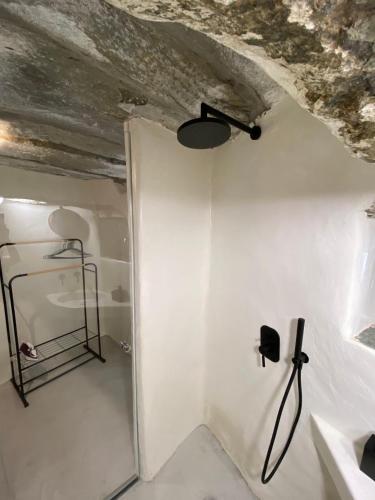 a room with a white wall and a ceiling at Persephone in Ioulis