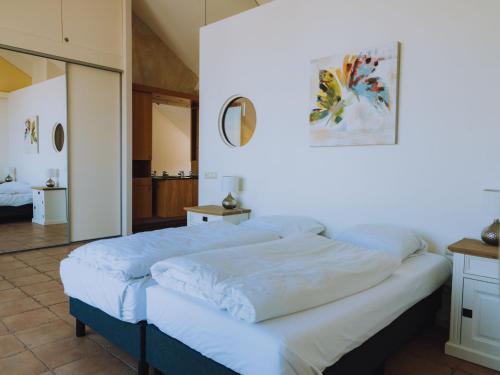 Katil atau katil-katil dalam bilik di Apartment Penthouse by Interhome