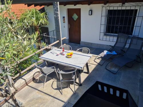 a table and chairs sitting on a patio at Apartment Casa Cavriana by Interhome in Magadino