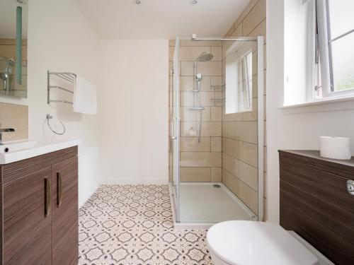 a bathroom with a shower and a toilet in it at Holiday Home Loch Ness House by Interhome in Drumnadrochit
