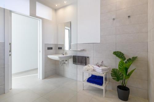 a bathroom with a sink and a mirror at Villa Ainara in Tías
