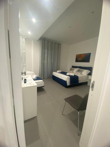 a hotel room with a bed and a sink at Porta Saracena Rooms in Agropoli