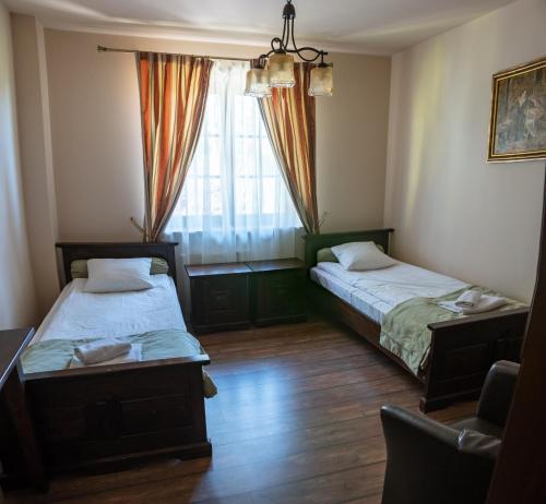 Postel nebo postele na pokoji v ubytování Glass Residence