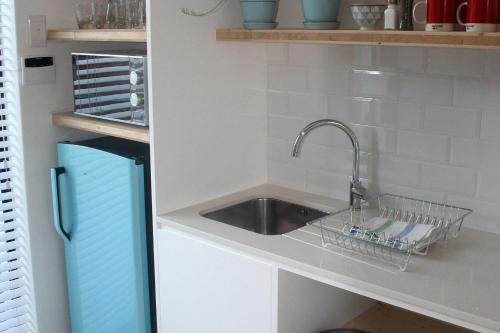 a kitchen counter with a sink and a sink at No. 9 Keurboom in Cape Town