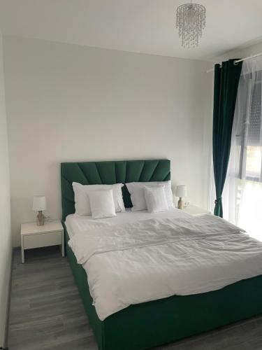 Ένα ή περισσότερα κρεβάτια σε δωμάτιο στο Apartament Mara