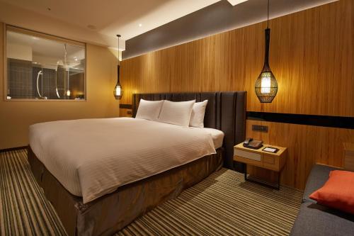 Posteľ alebo postele v izbe v ubytovaní La Vida Hotel