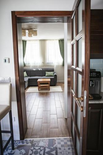 a living room with a couch and a table at City-Top Vendégház in Esztergom