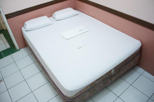 Ένα ή περισσότερα κρεβάτια σε δωμάτιο στο GV Hotel - Catarman