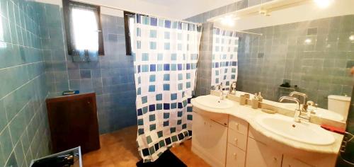 a bathroom with a sink and a mirror at Gite libecciu in Pietracorbara