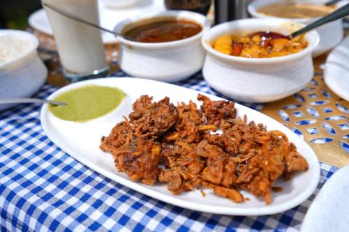 a plate of food on top of a table at Chirping Hills Resort,Bhimtal in Bhīm Tāl