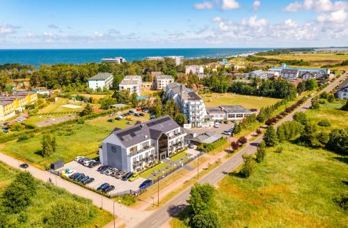 an aerial view of a town with the ocean at Apartamenty N7 in Darłówko