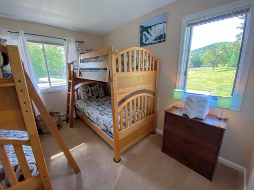 a bedroom with two bunk beds and a window at F4 Warm Fairway Village Townhome mountain views and large lawn So much to do in Carroll