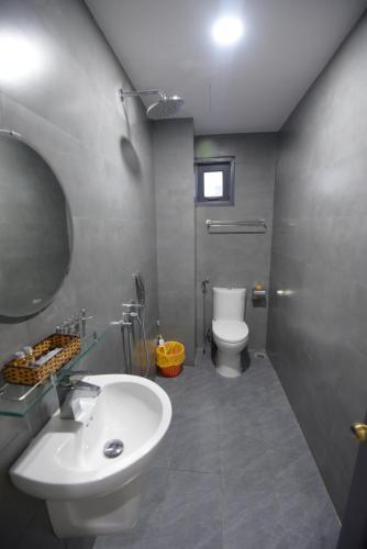 a bathroom with a sink and a toilet at CHIENHOA HOMESTAY in Danang
