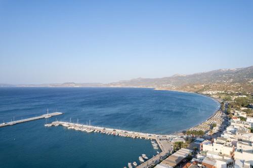 an aerial view of a marina with boats in the water at De President Suite, DeMaNi President Suites in Sitia