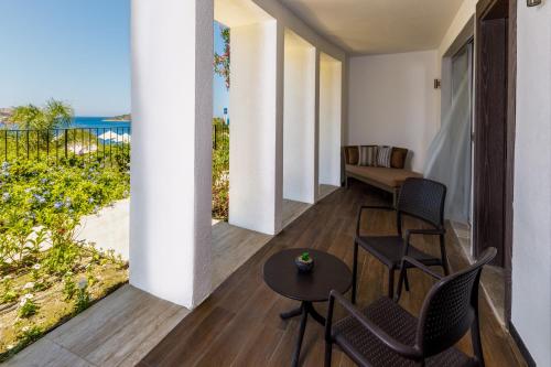 a room with a view of the ocean at Sirene Luxury Hotel Bodrum in Yalıkavak