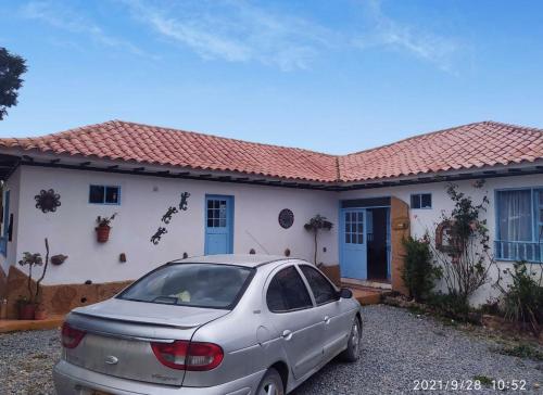 a car parked in front of a house at CASA VILLA LUGUIANGA Villa de Leyva in Villa de Leyva