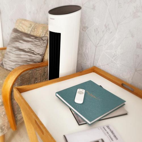 a table with a cell phone sitting on top of it at Photoeverhome in Bengtsfors