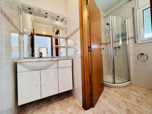 a bathroom with a sink and a shower at MAS NOU 2 in Castelló d'Empúries