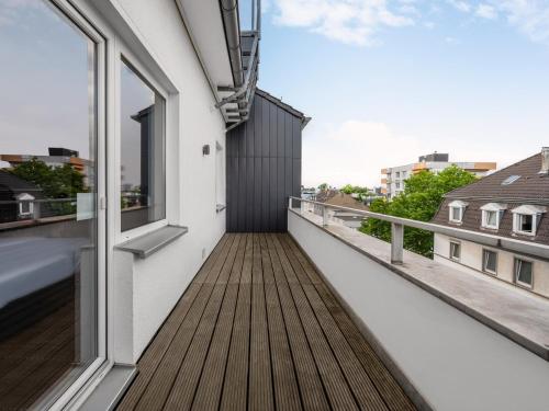 a balcony with a view of a building at numa I Artol Rooms & Apartments in Düsseldorf