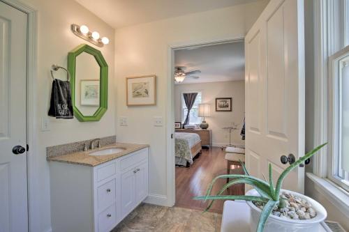 a bathroom with a sink and a mirror and a bedroom at Spacious and Modern Ashley Falls Home on 1 Acre 