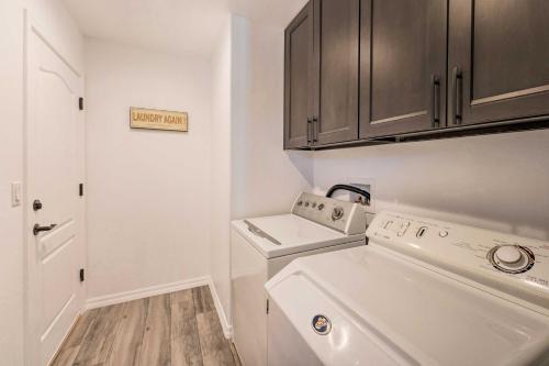 a laundry room with a washer and dryer at Pet-Friendly Bullhead City Abode with Game Room in Bullhead City