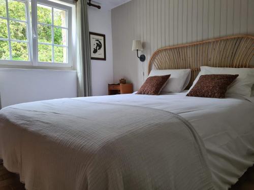 Кровать или кровати в номере La Maison des Tilleuls