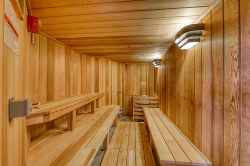 an empty wooden sauna with wooden benches in it at Solitude Village H102 in Ludlow