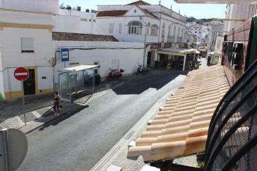 an empty street in a city with buildings at Casa Pérola, Old Town Apartment in Albufeira