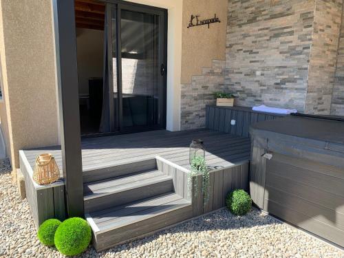 a front porch with stairs and a house at L'escapade - Chambre d'hôtes de charme avec Spa et piscine en Cévennes in Laval-Pradel
