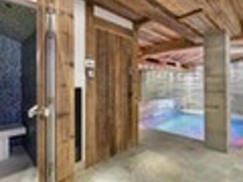 a room with a door and a swimming pool at Chalet Val-d'Isère, 7 pièces, 14 personnes - FR-1-567-38 in Val-d'Isère