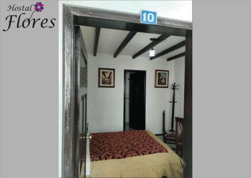 Letto o letti in una camera di Hostal Flores