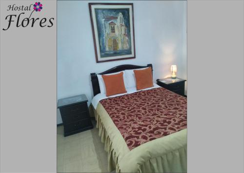 Letto o letti in una camera di Hostal Flores