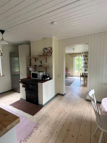 a kitchen with a table and a counter top at Charlottenborg in Söderköping