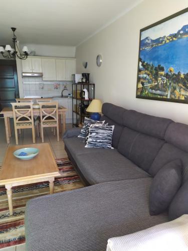 a living room with a couch and a table at For your best holiday in Rocas del Mar with amazing ocean view in Costa Del Silencio