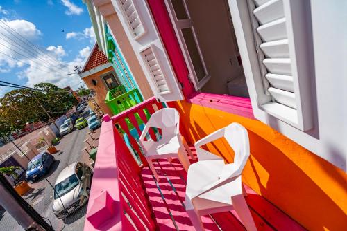 a room with a rainbow painted on the side of a building at Wynwood Boutique Hotel in Willemstad