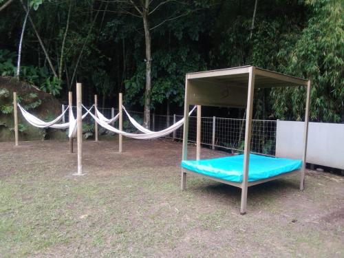 a swing set with a net and a hammock at CASA LUZ Hospedaje, Pereira , Cerritos in Pereira