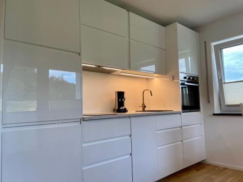 Kuchyň nebo kuchyňský kout v ubytování Exploria Apartments