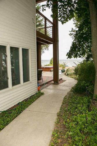 a porch of a house with a view of the ocean at Libby's Cove in Carsonville