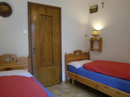Katil atau katil-katil dalam bilik di Appartamento Niki Campitello